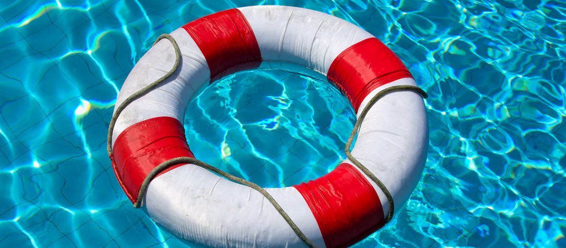 Life buoy in blue swimming pool